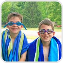 two boys getting ready to swim