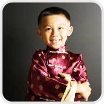 child dressed in traditional Chinese costume