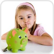 girl looking at piggy bank
