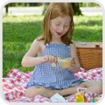 girl eating a picnic lunch