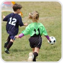 two kids playing soccer